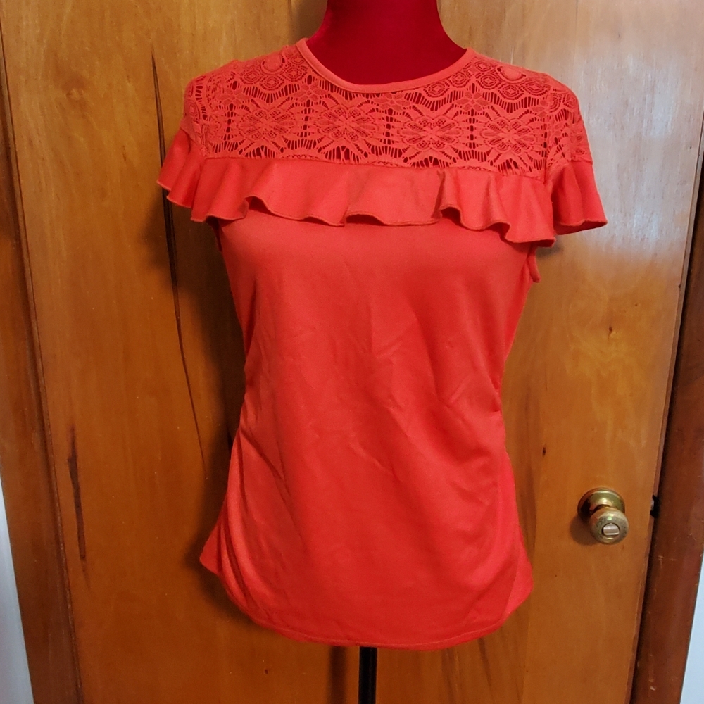 Flattering Lazer cut orange top